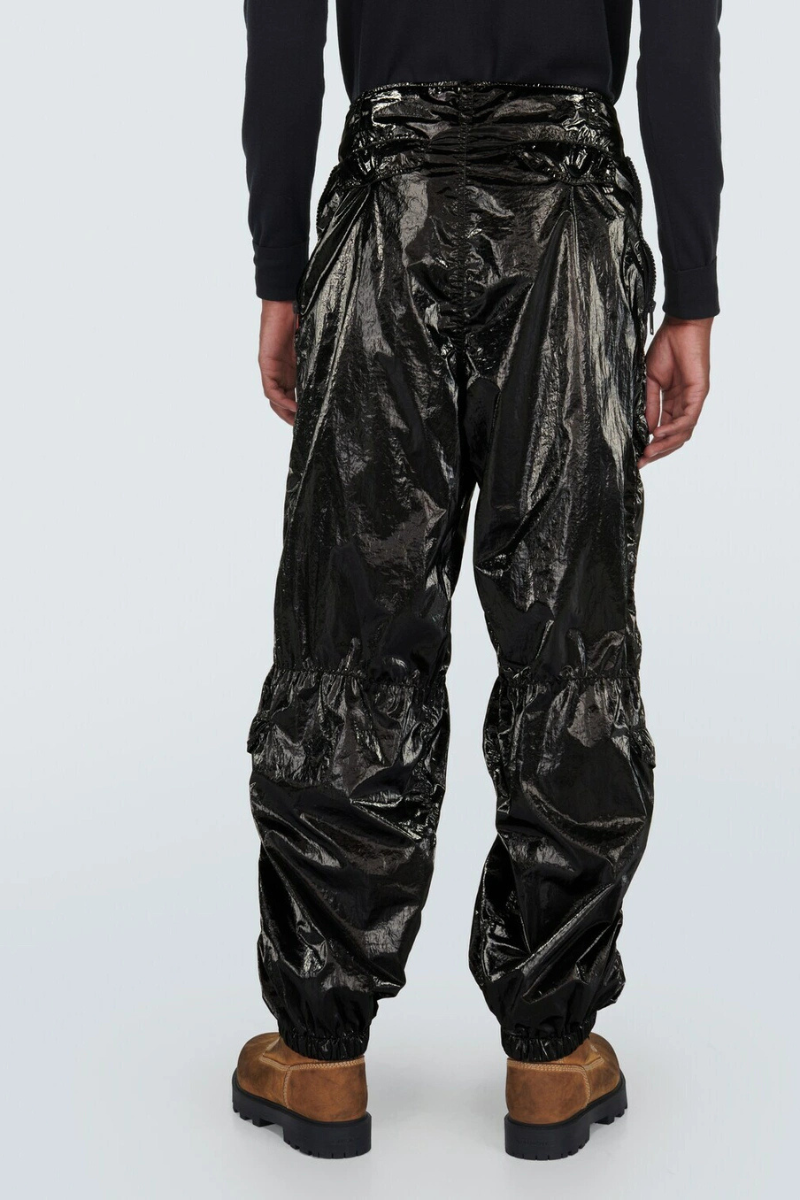 Givenchy Technical Cargo Pants showcased from the back, featuring a glossy black finish and elasticated cuffs.
