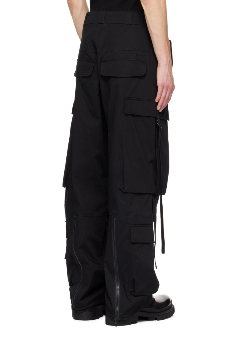 Givenchy Black Extended Trim Cargo Pants displayed from the back, featuring cargo pockets and zip expansion panel.