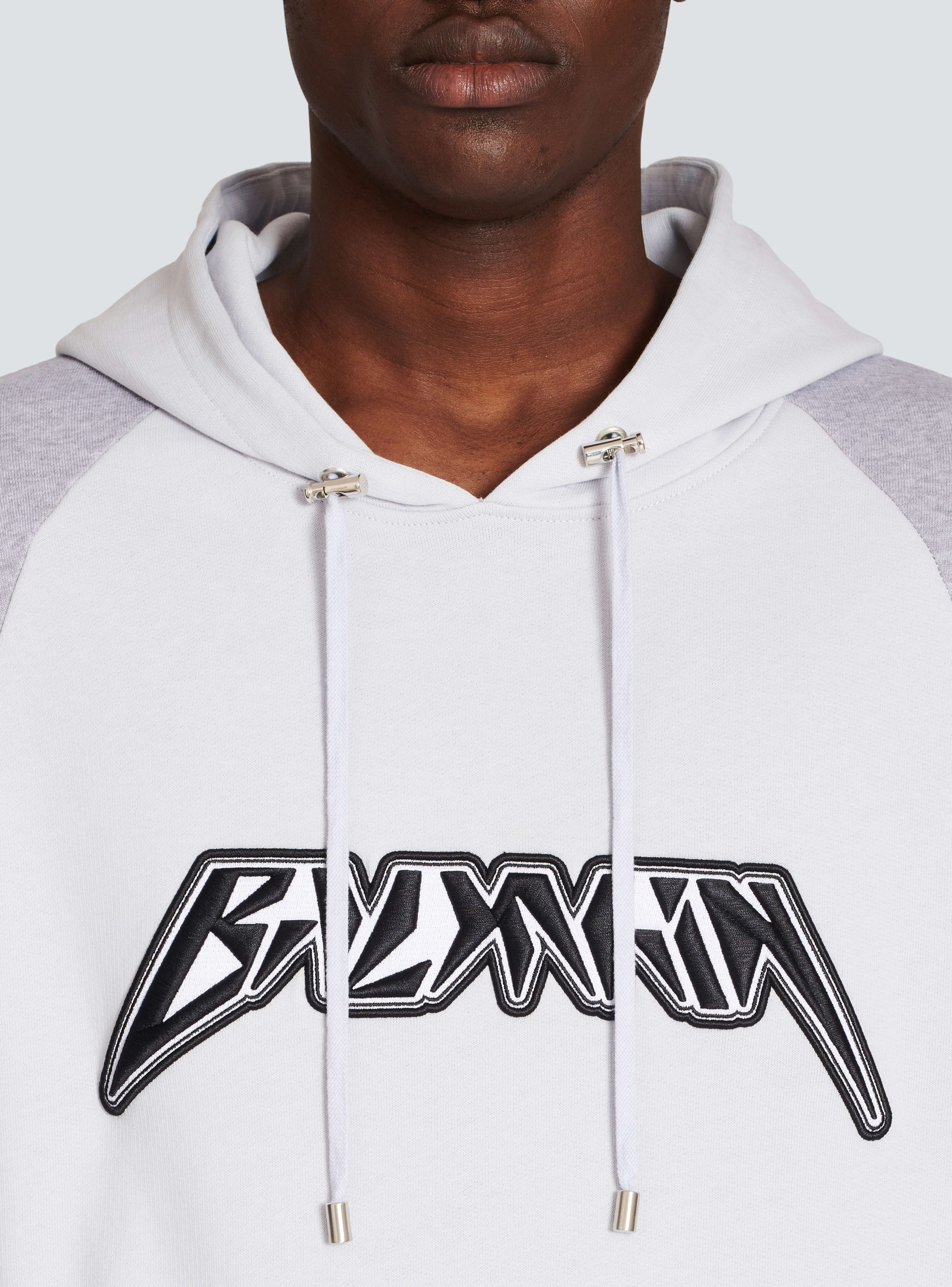 BALMAIN MEN'S LIGHT BLUE BLACK OVERSIZED HOODIE