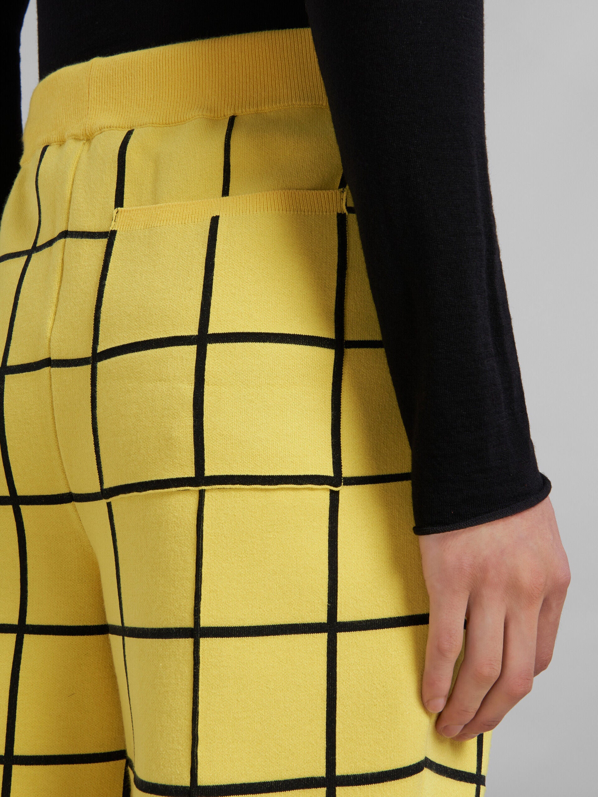 MARNI MEN'S YELLOW GRID PATTERN FLARED TROUSERS