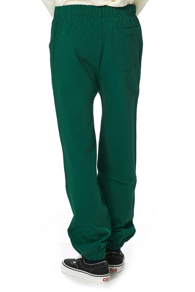 Drake's Cotton Jogging Bottoms in Green showing back view with elastic waist and cuffed bottom.