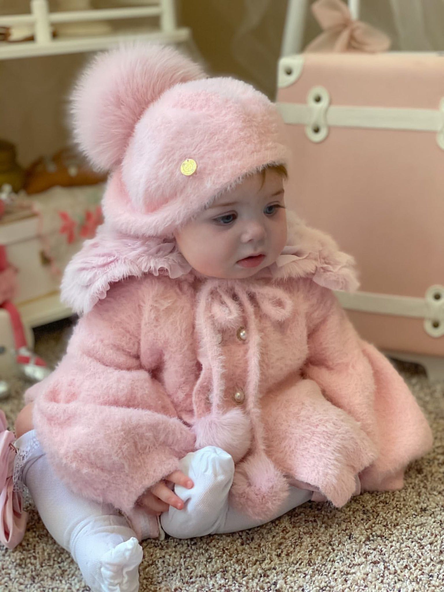 Little girl wearing Milana Rose Beret with plush pom pom and coordinating pink faux fur coat.
