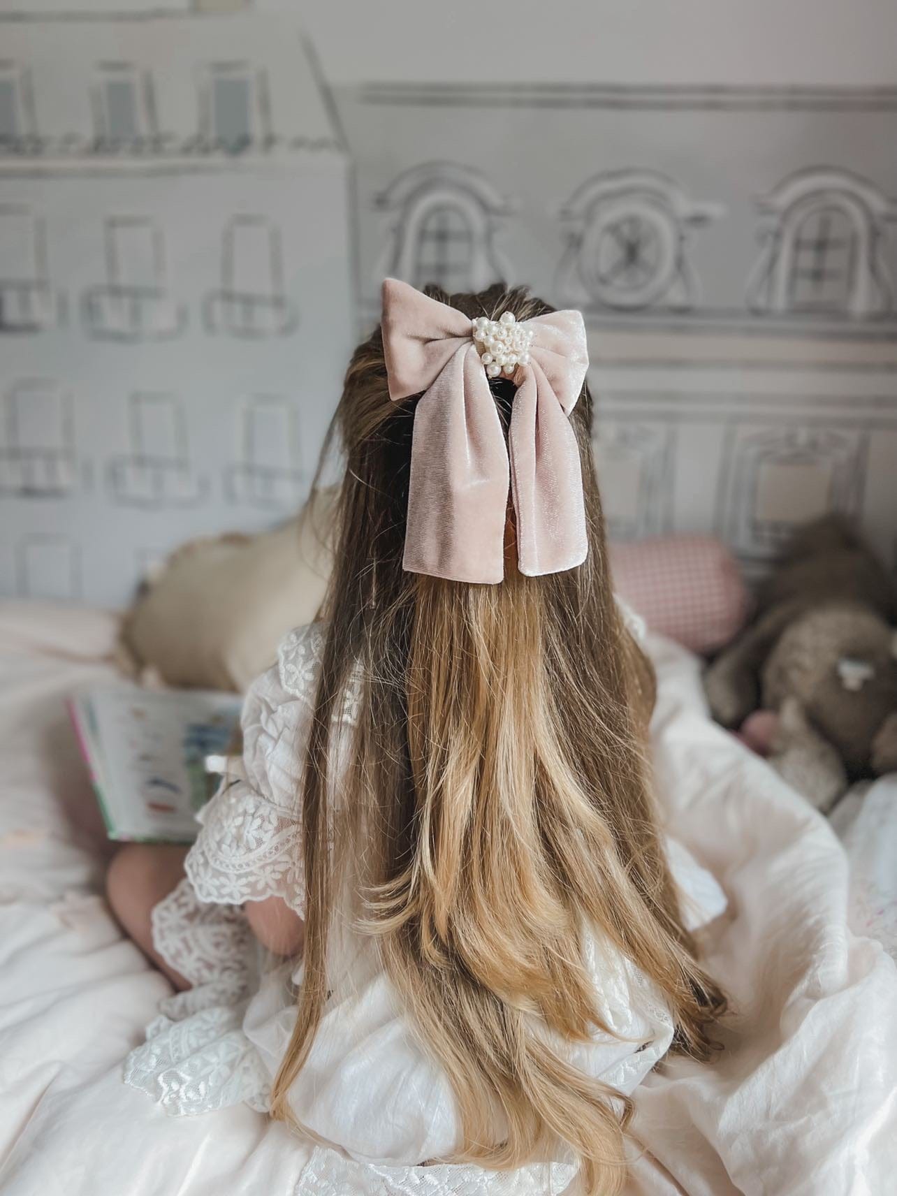 Dusty Pink Velvet Hair Bow laid flat displaying rich dusty blush velvet and structured symmetrical bow design
