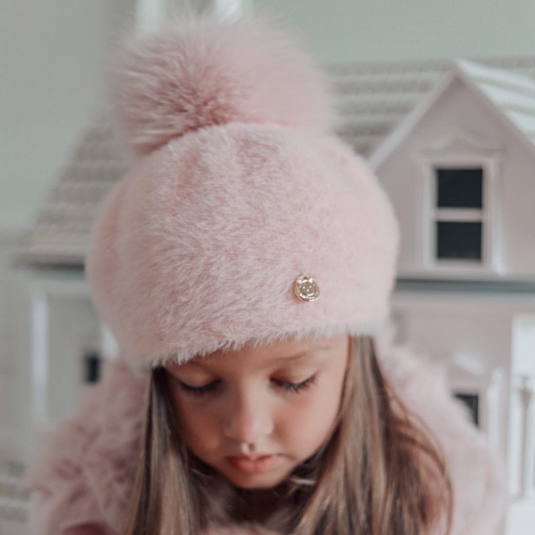 Little girl wearing Milana Rose Beret featuring fluffy rose pink faux fur and pom pom detail for winter styling.