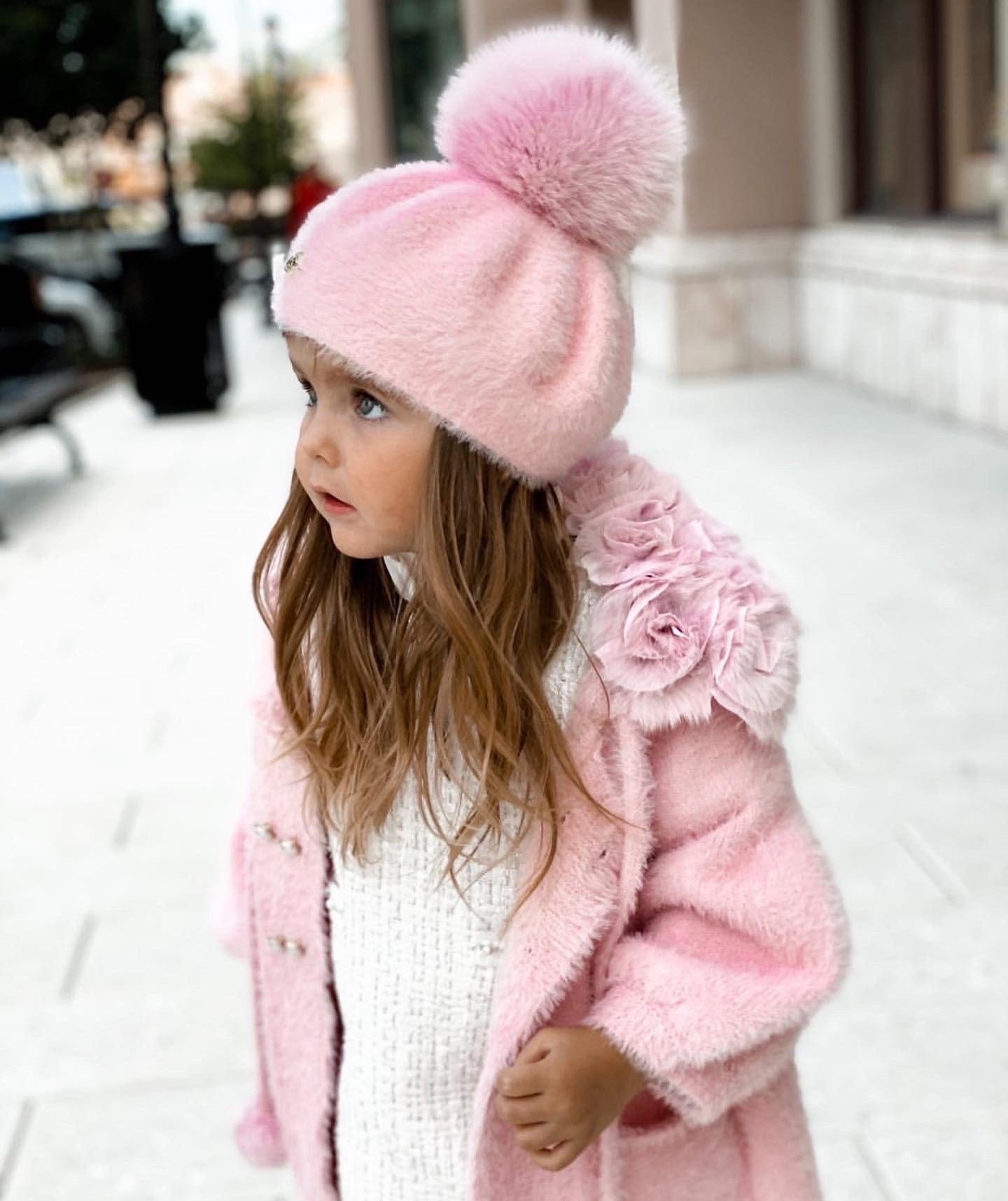 Side profile of Milana Rose Beret in rose pink faux fur, featuring large pom pom and soft winter texture.