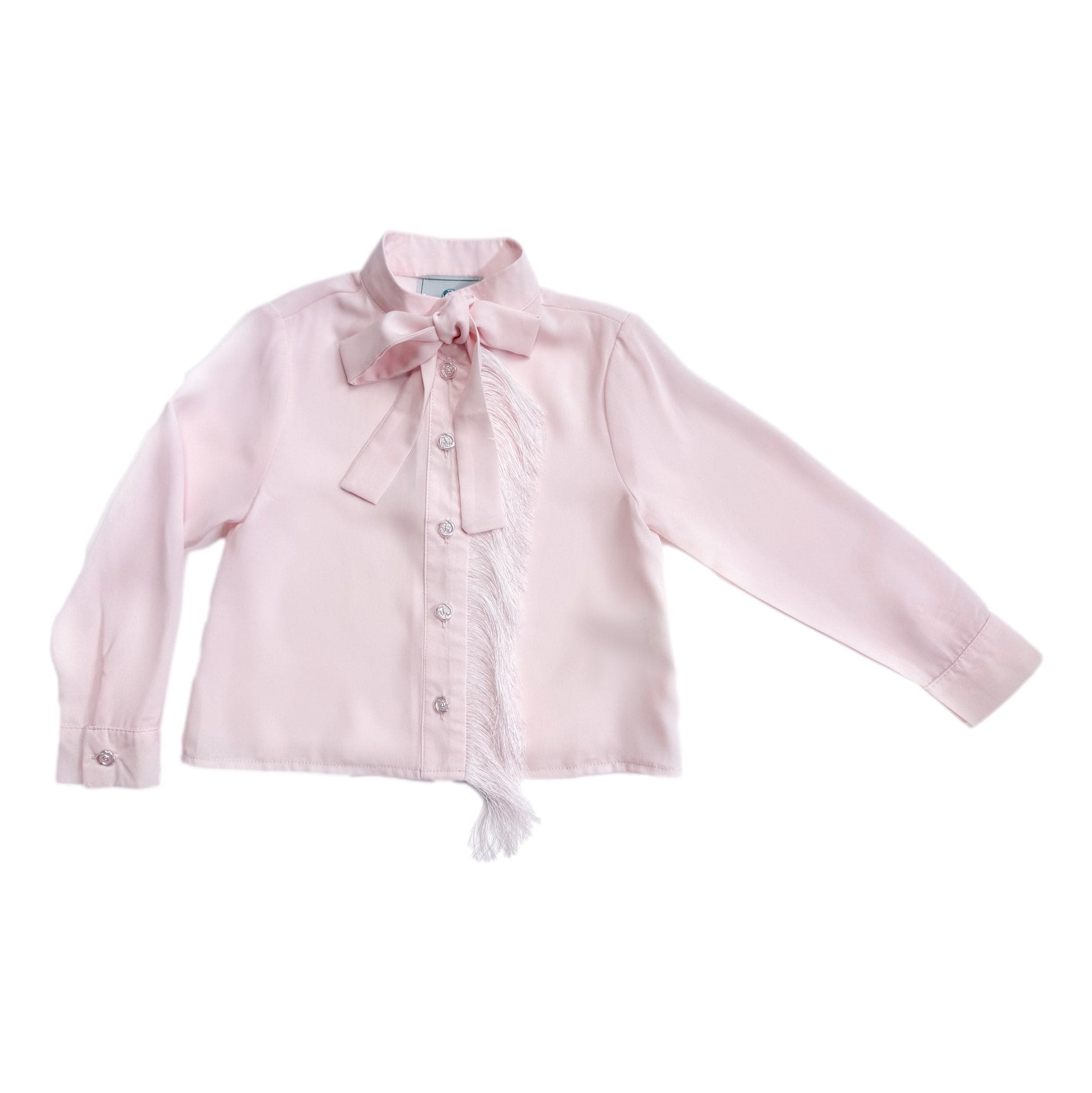 Pink crepe fringe blouse for girls featuring delicate tassel detailing, white rosebud buttons, and a feminine pussycat bow front.