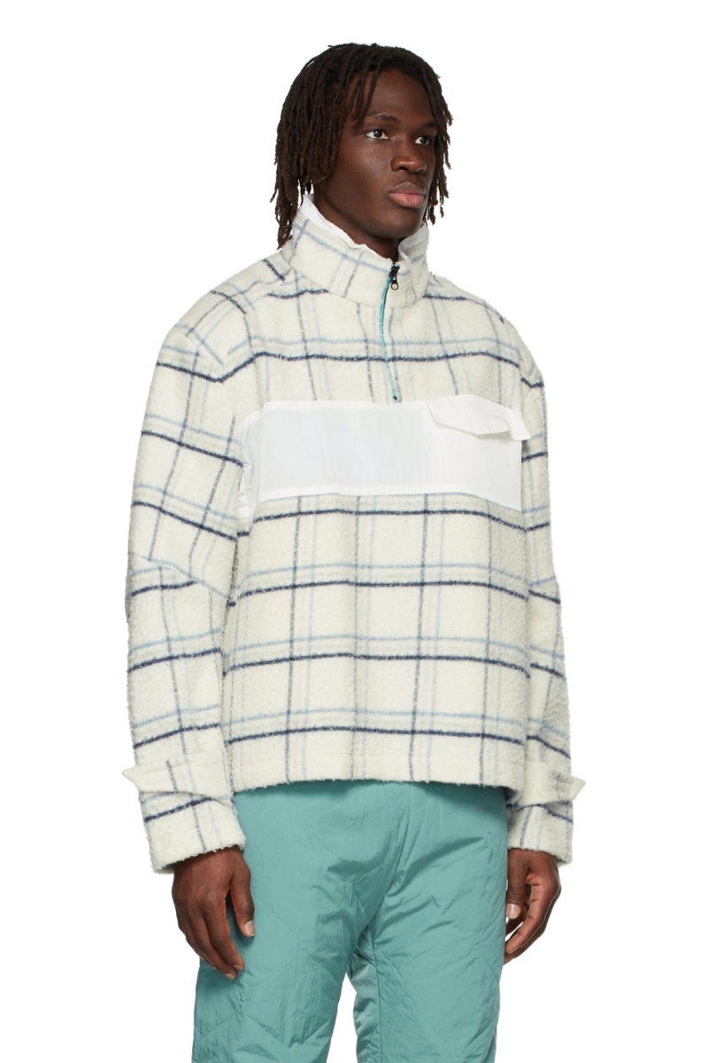RK Exclusive Off-White Fleece Track Jacket worn by model featuring checked blue pattern and half-zip stand collar.