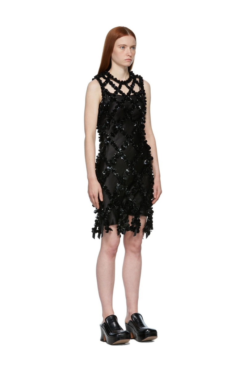 Shushu/Tong Black Sequin Dress worn by a model, showcasing the intricate sequined design and luxurious fabric.