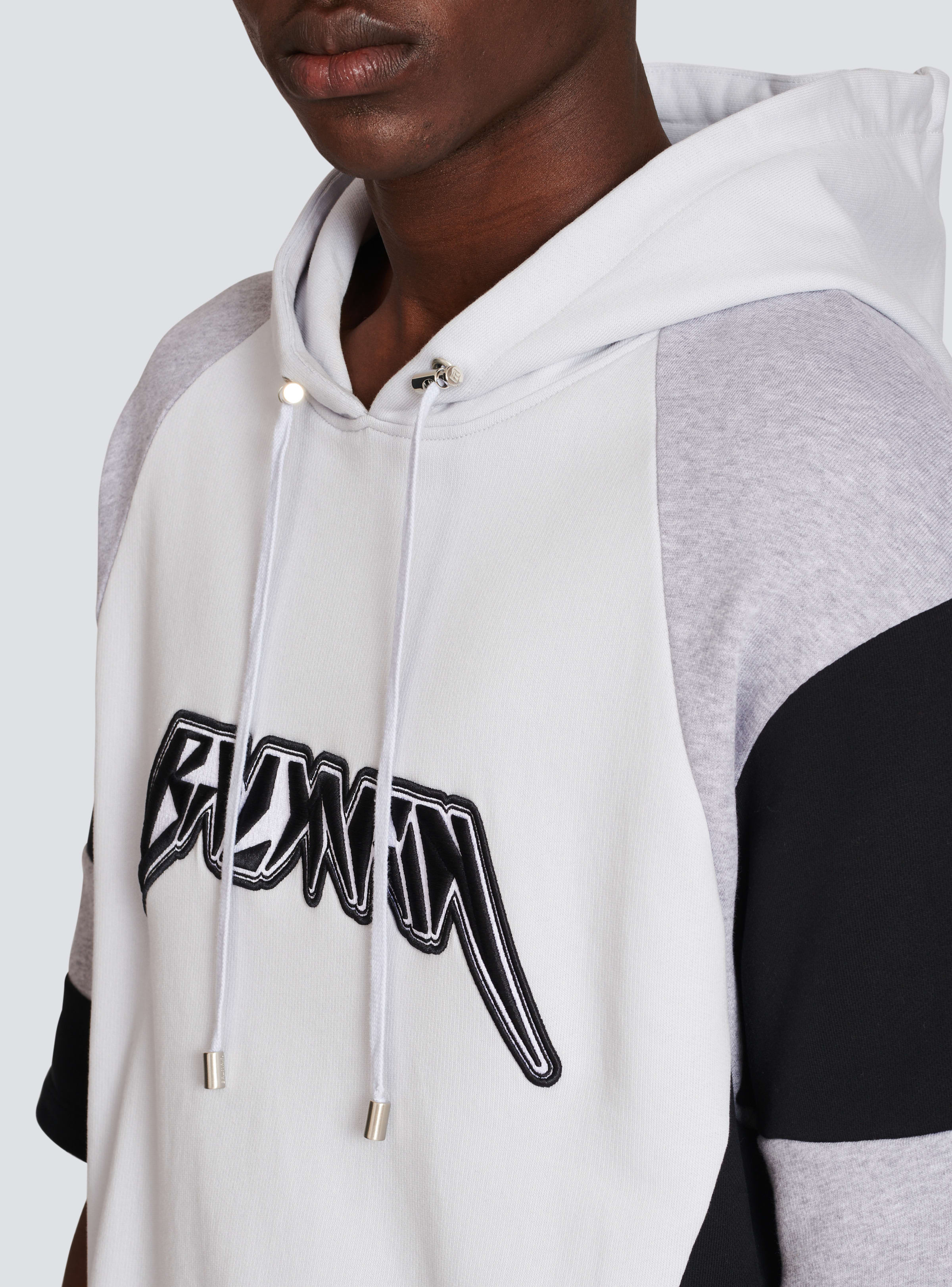 BALMAIN MEN'S LIGHT BLUE BLACK OVERSIZED HOODIE