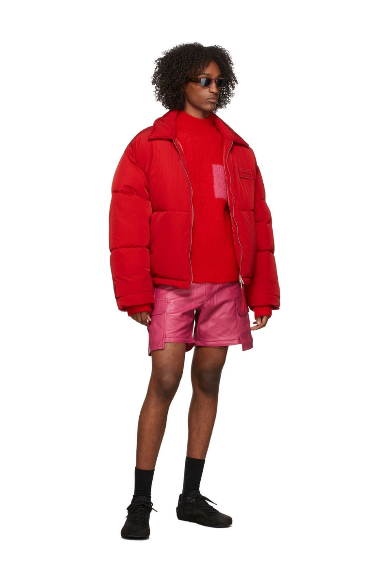 Jacquemus La Montagne ‘Le Pantalon Pêche’ Leather Pants worn with a red puffer jacket and stylish accessories.