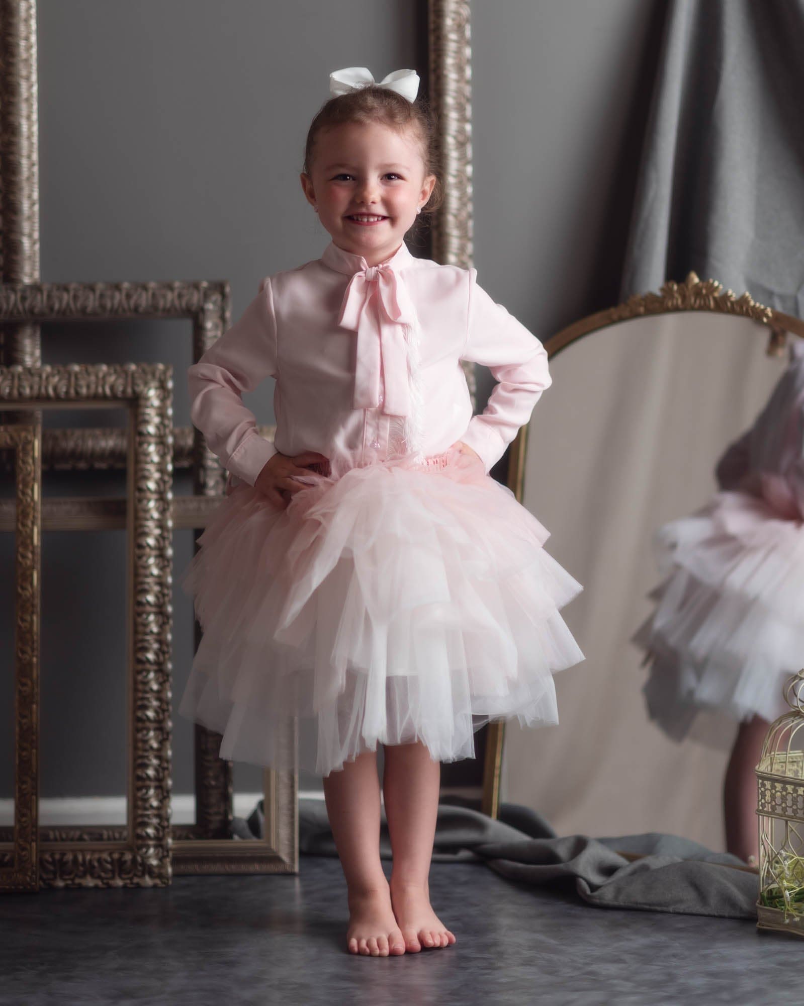Blush ombré tulle skirt for girls with soft layered volume and elegant ribbon waist tie detail.