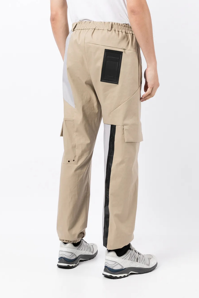 A-Cold-Wall Men's Two-Tone Casual Trousers view from the back in beige with cargo pockets and elastic waistband.