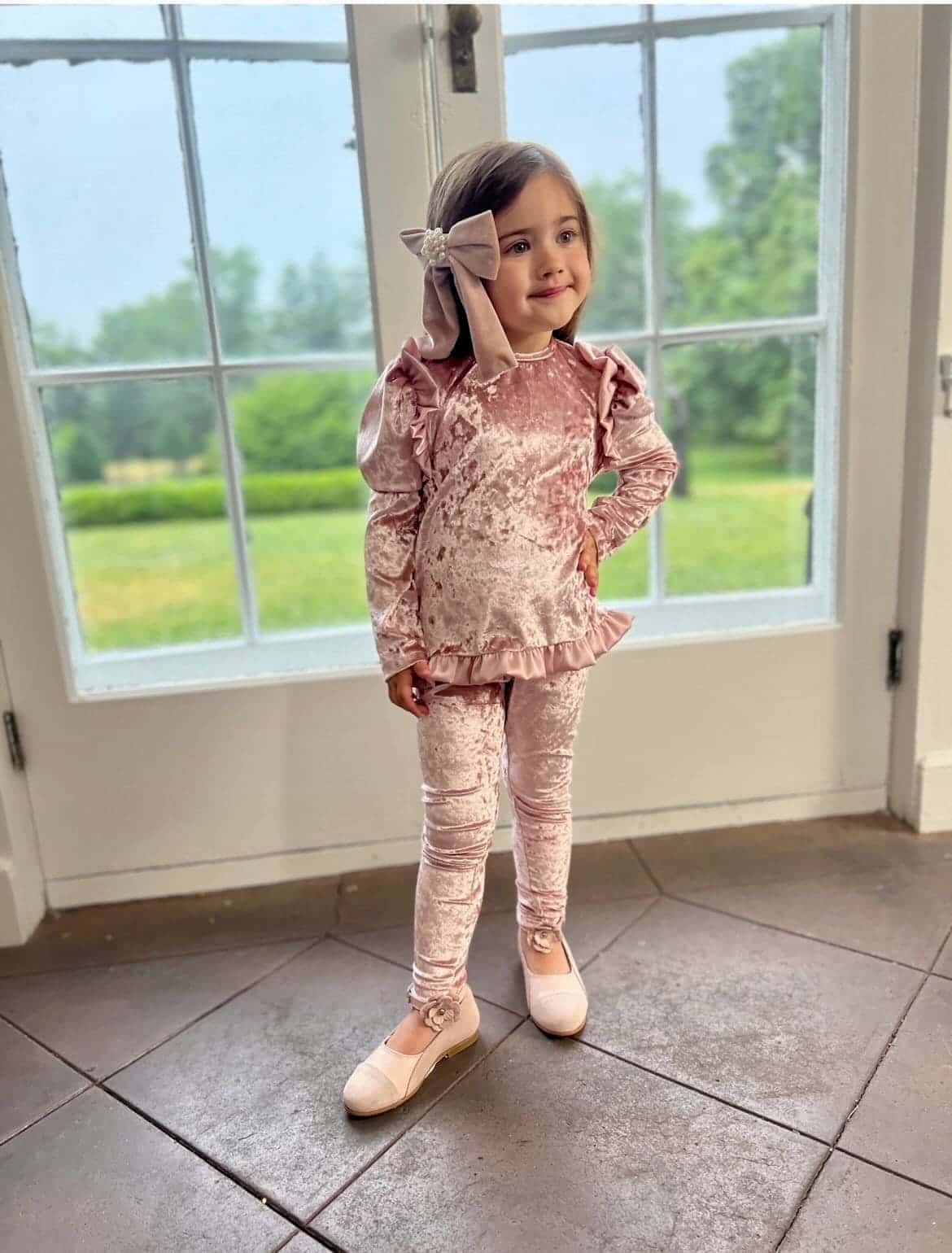 Pink velour lounge set for girls featuring plush velvet fabric and feminine ruffle details, elegant children's loungewear
