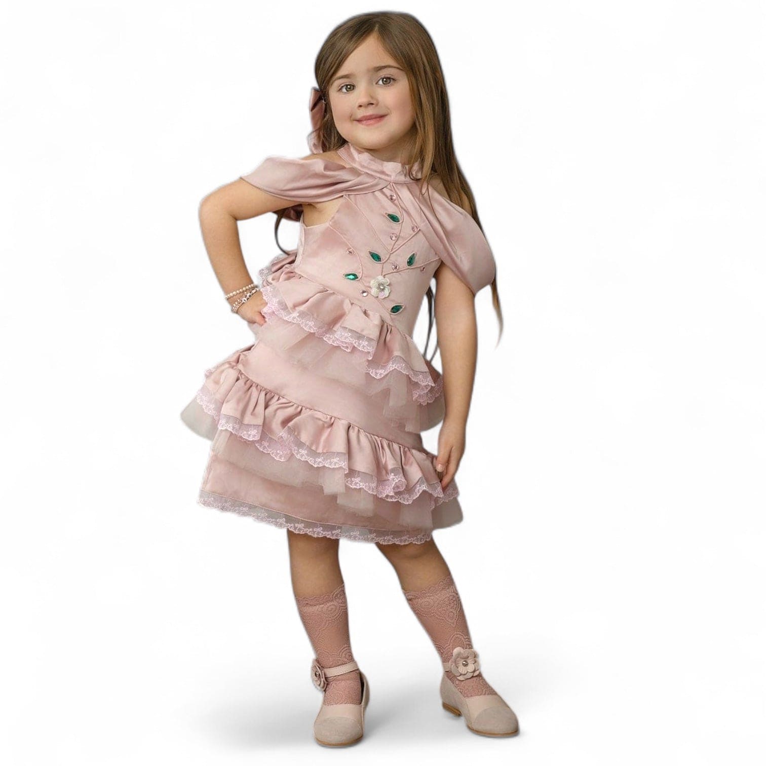 Pink satin ballerina dress featuring a pleated bodice, jewel embellishments, and a layered ruffle skirt, styled on a young girl 