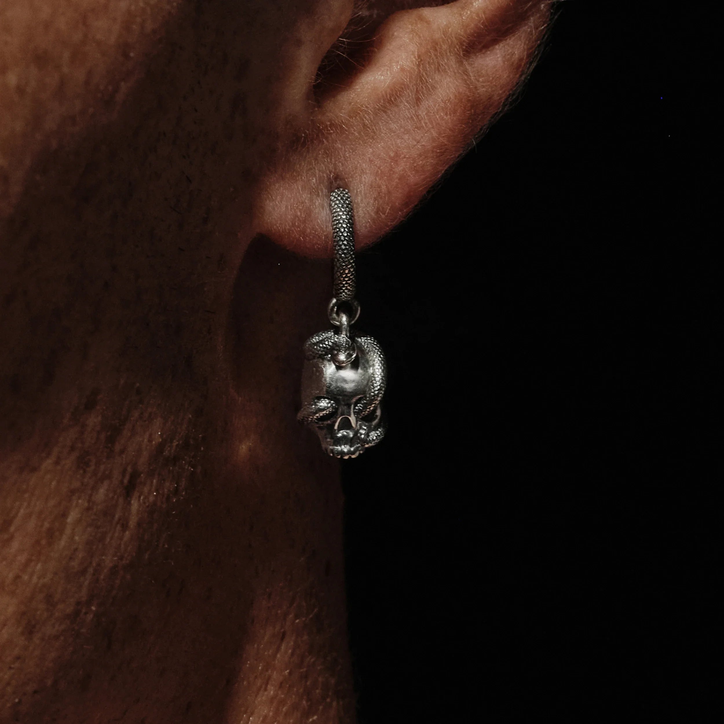 Awe Inspired Earrings Single Serpent Skull Huggie