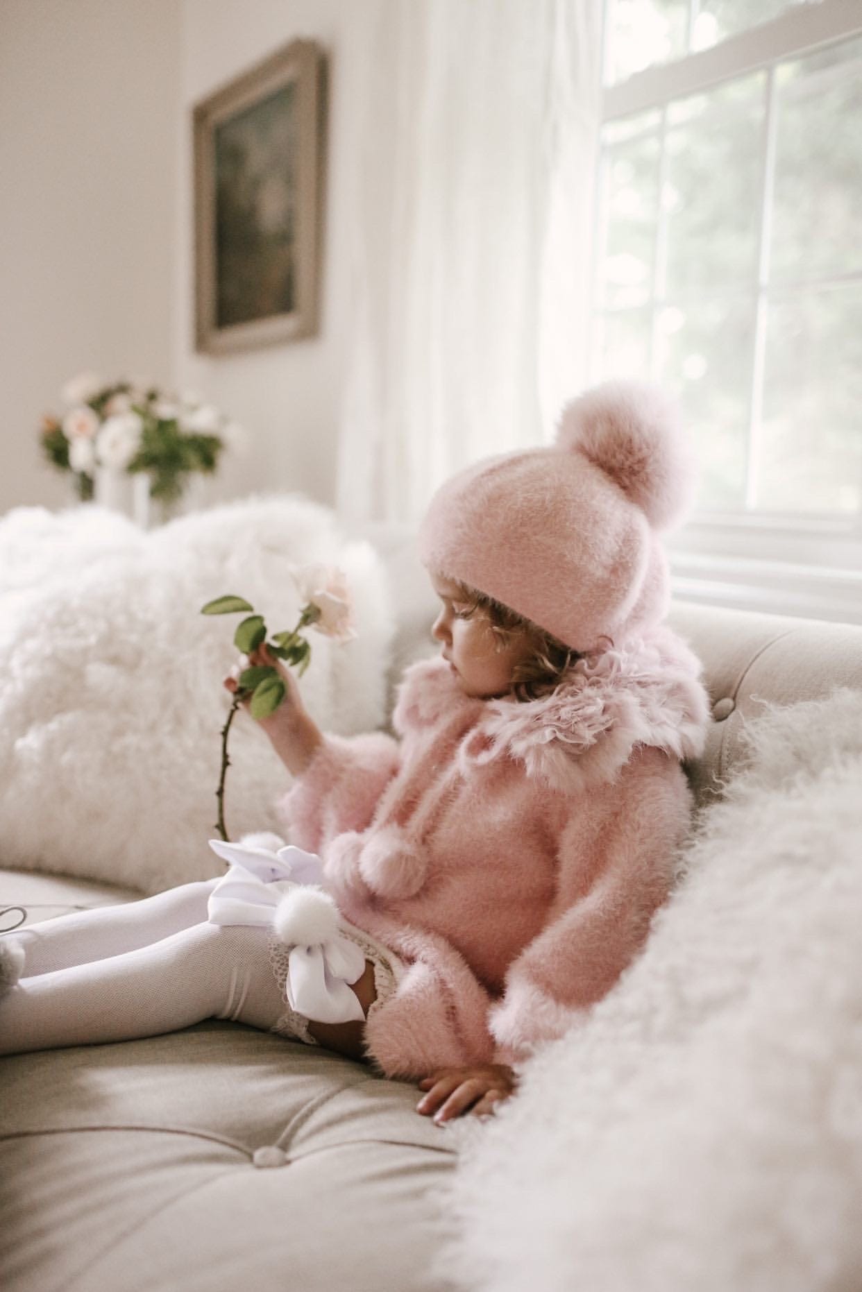 Milana Rose Beret in soft blush pink faux fur with oversized pom pom and plush texture detail.