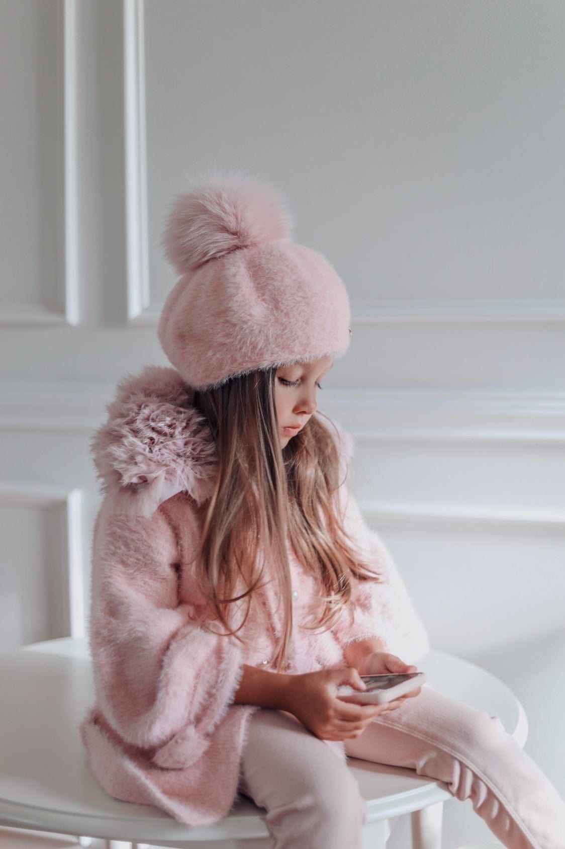 Side view of Milana Rose Beret with oversized pom pom top and soft plush texture for girls winter fashion.