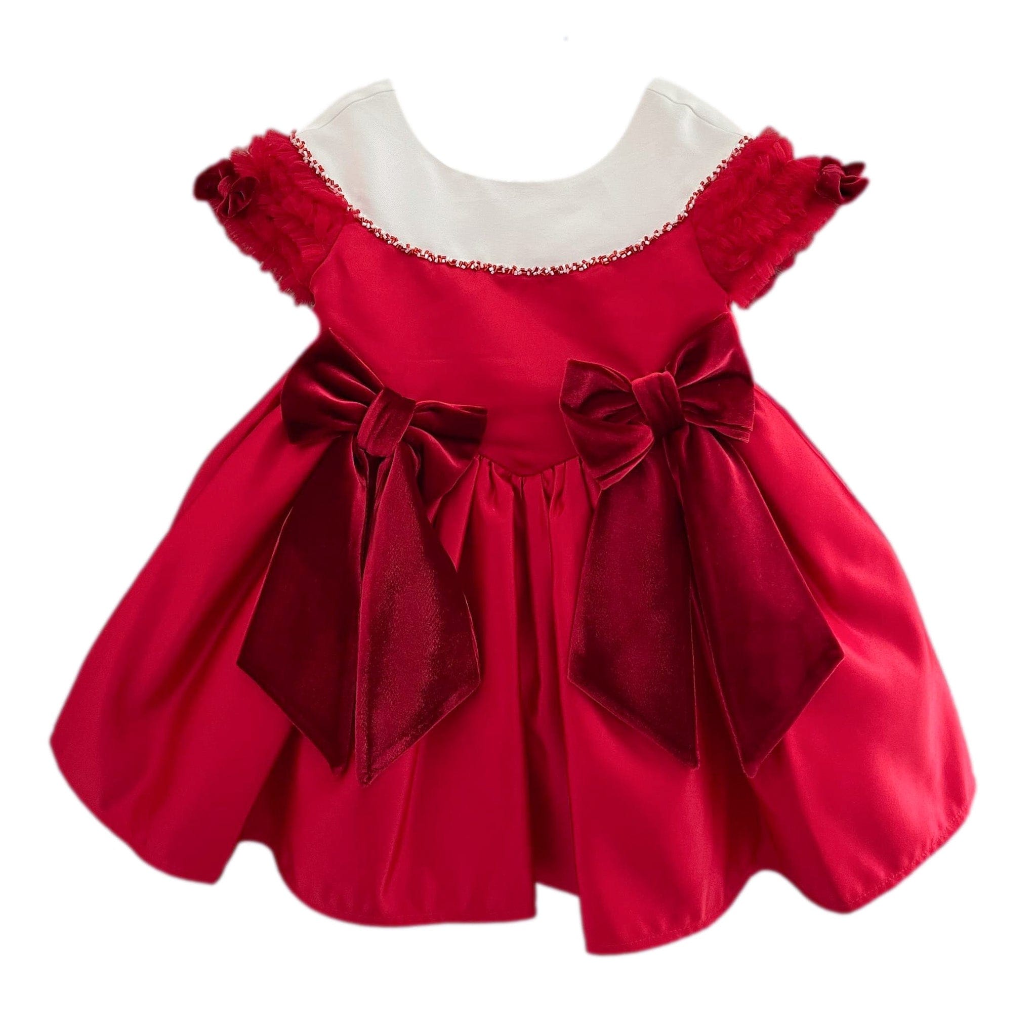 Holly Red Amad satin ceremony dress for girls featuring rich red satin, white collar neckline, and oversized velvet bow details on the waist.